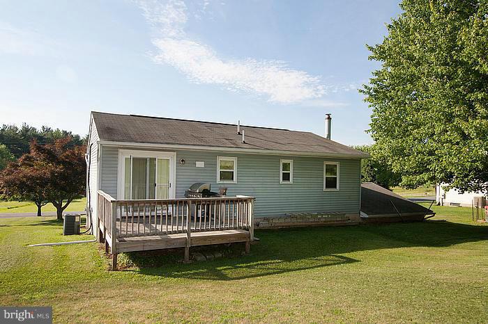 3244 Lineboro Road Manchester, MD 21102 - Photo 25 of 29 a view of a house with a yard and deck