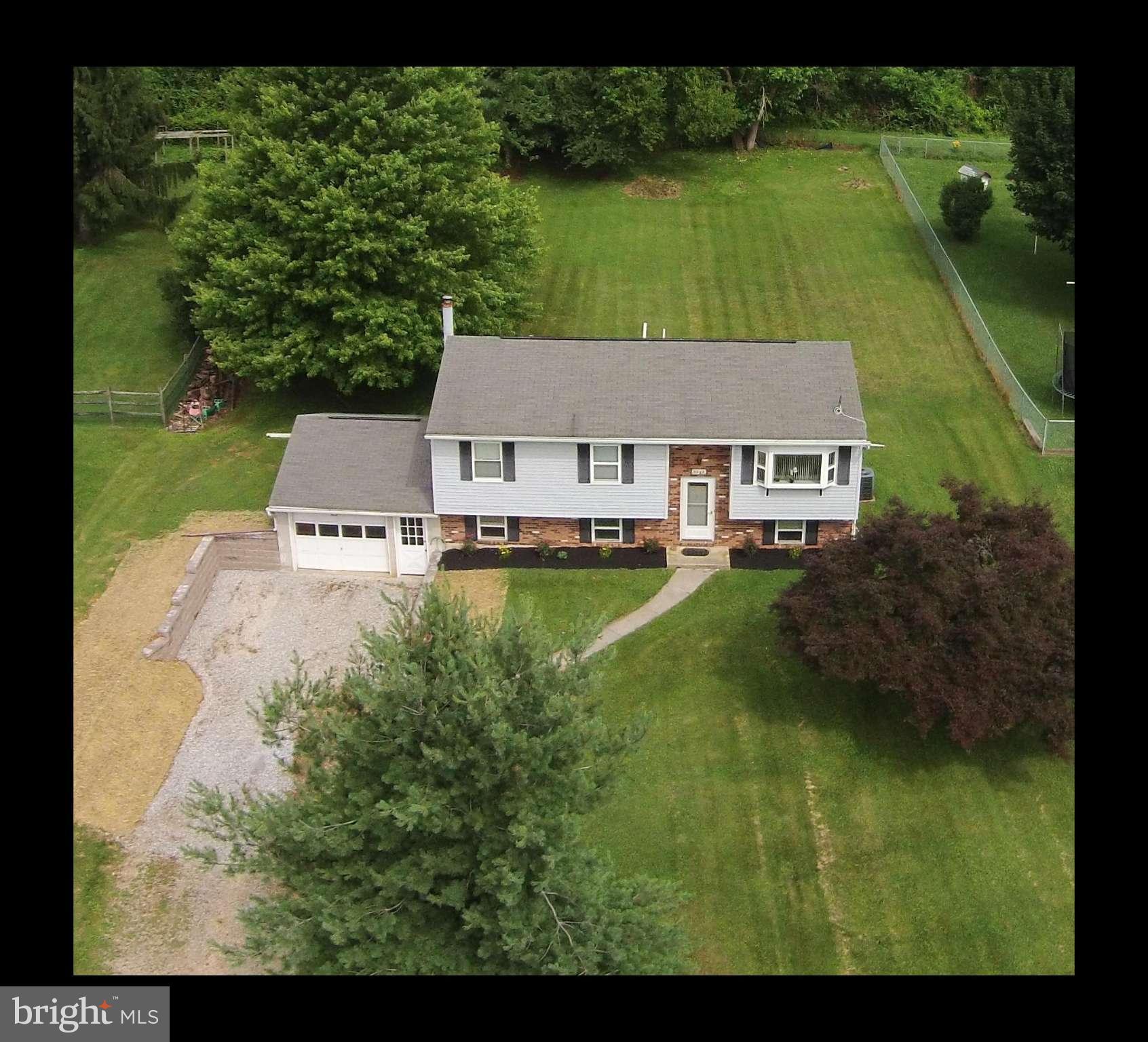 3244 Lineboro Road Manchester, MD 21102 - Photo 28 of 29 a aerial view of a house with garden space and a lake view