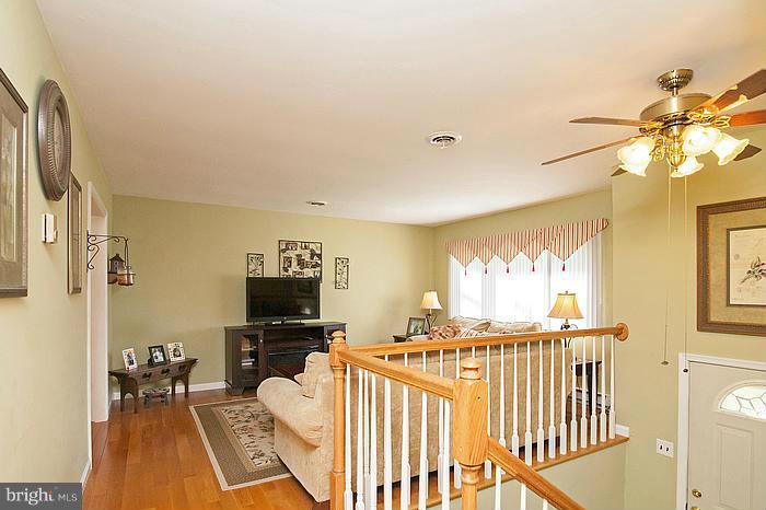 3244 Lineboro Road Manchester, MD 21102 - Photo 5 of 29 a living room with furniture tv and a table