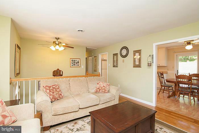 3244 Lineboro Road Manchester, MD 21102 - Photo 6 of 29 a living room with furniture and wooden floor