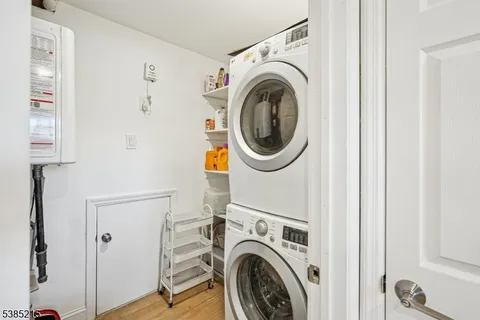 a view of a hallway with washer and dryer