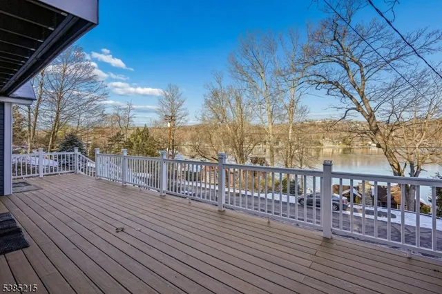 a view of a balcony with wooden floor