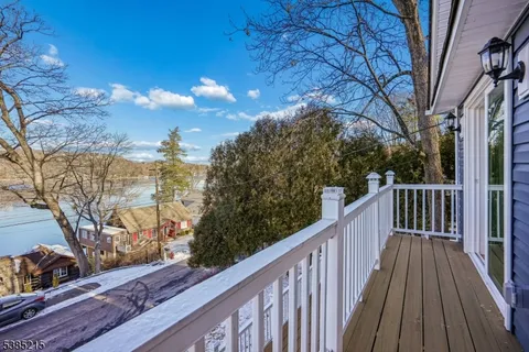 a view of a balcony with wooden fence