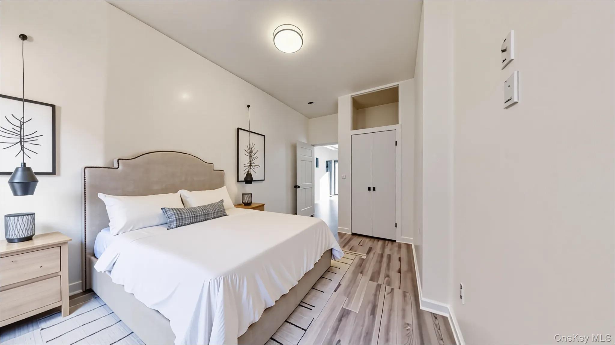 1545 Broadway, Unit 3 Brooklyn, NY 11221 - Photo 2 of 6 a bedroom with bed and wooden floor