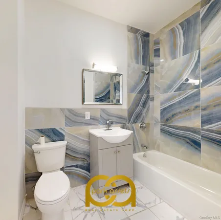 a bathroom with a sink a toilet and a bathtub