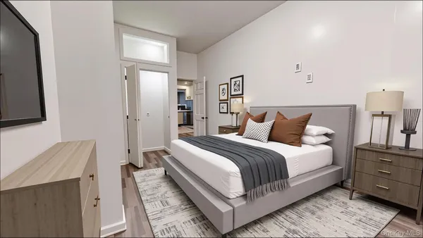a bedroom with a bed and a night stand