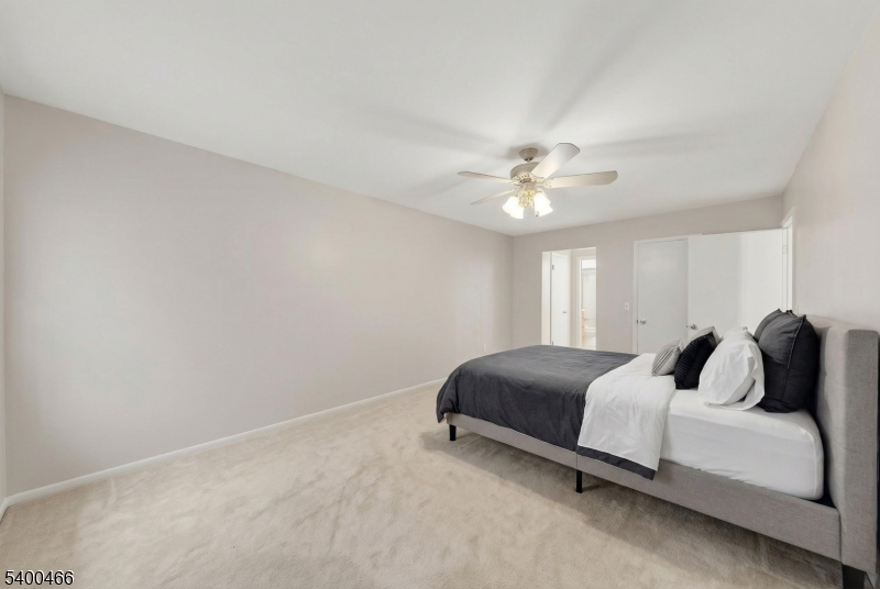 32 Rhea Run Newton, NJ 07860 - Photo 12 of 31 a bedroom with a bed and a chandelier