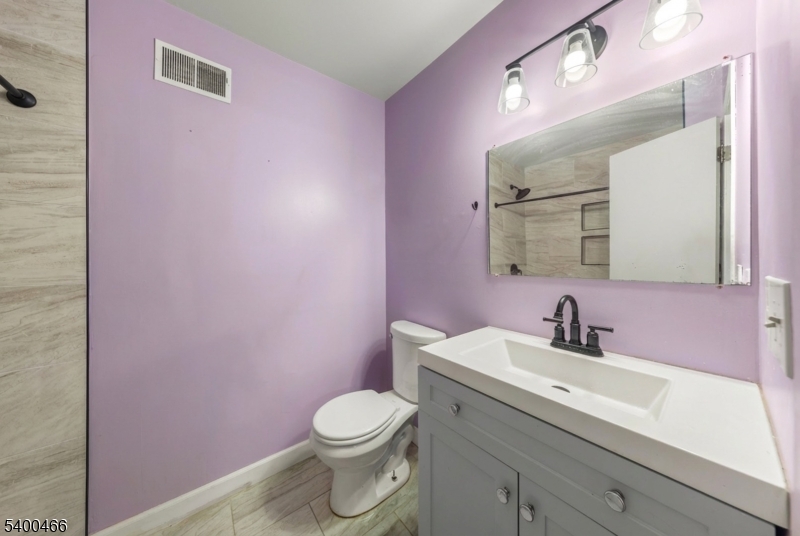 32 Rhea Run Newton, NJ 07860 - Photo 14 of 31 a bathroom with a sink mirror vanity and toilet