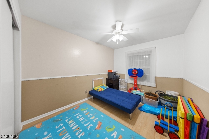 32 Rhea Run Newton, NJ 07860 - Photo 20 of 31 a living room with baby crib furniture and a wooden floor