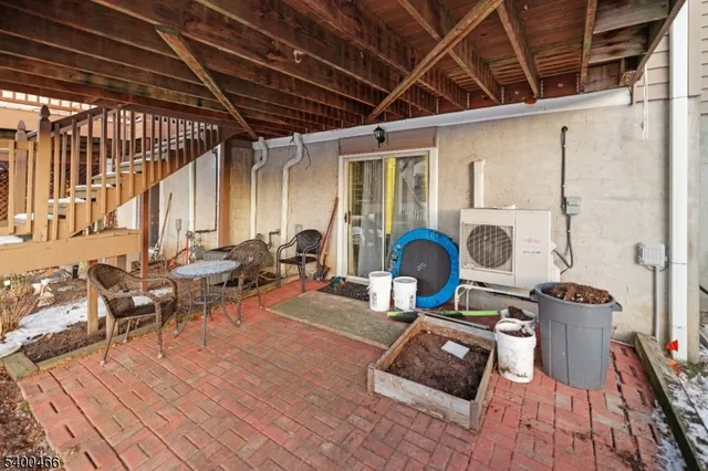 a living room with furniture a rug and a wooden floor
