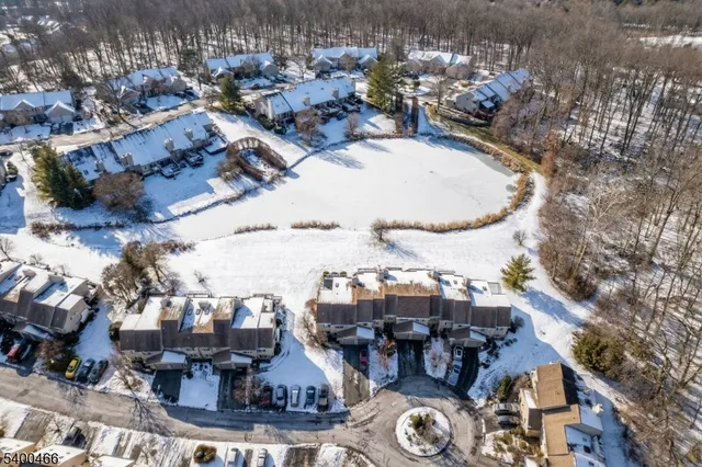 an aerial view of a house with outdoor space