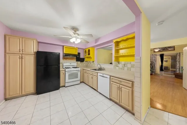 a kitchen with stainless steel appliances a refrigerator and a stove top oven
