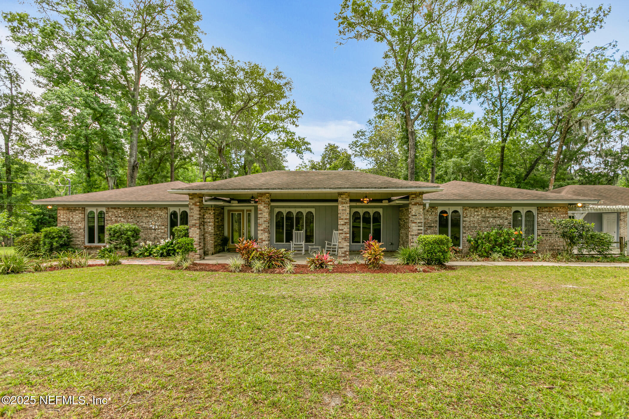 a front view of a house with patio yard and patio