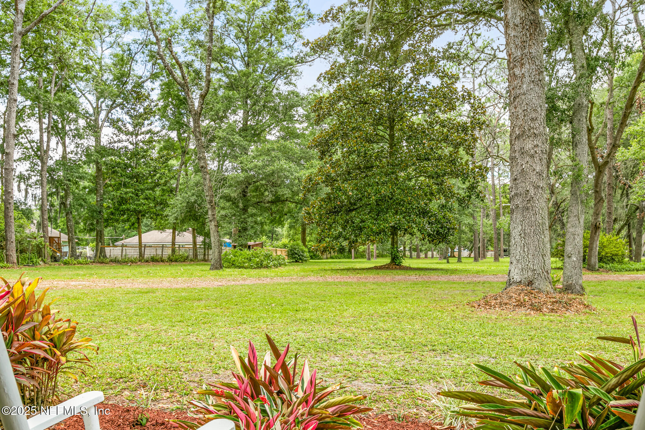 12657 Aladdin Road Jacksonville, FL 32223 - Photo 2 of 47 a view of a swimming pool and a big yard