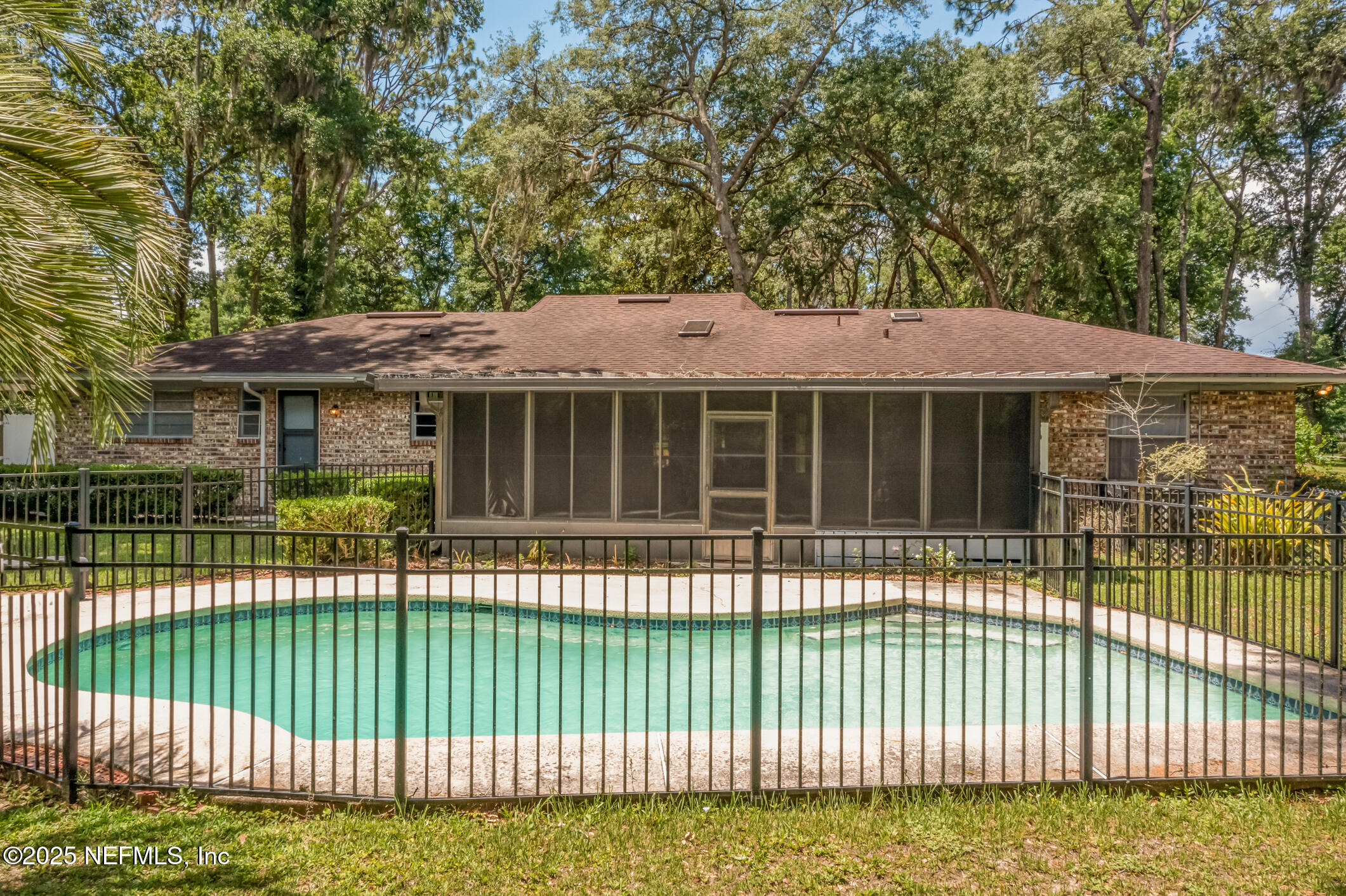 12657 Aladdin Road Jacksonville, FL 32223 - Photo 35 of 47 a front view of a house with a garden and plants