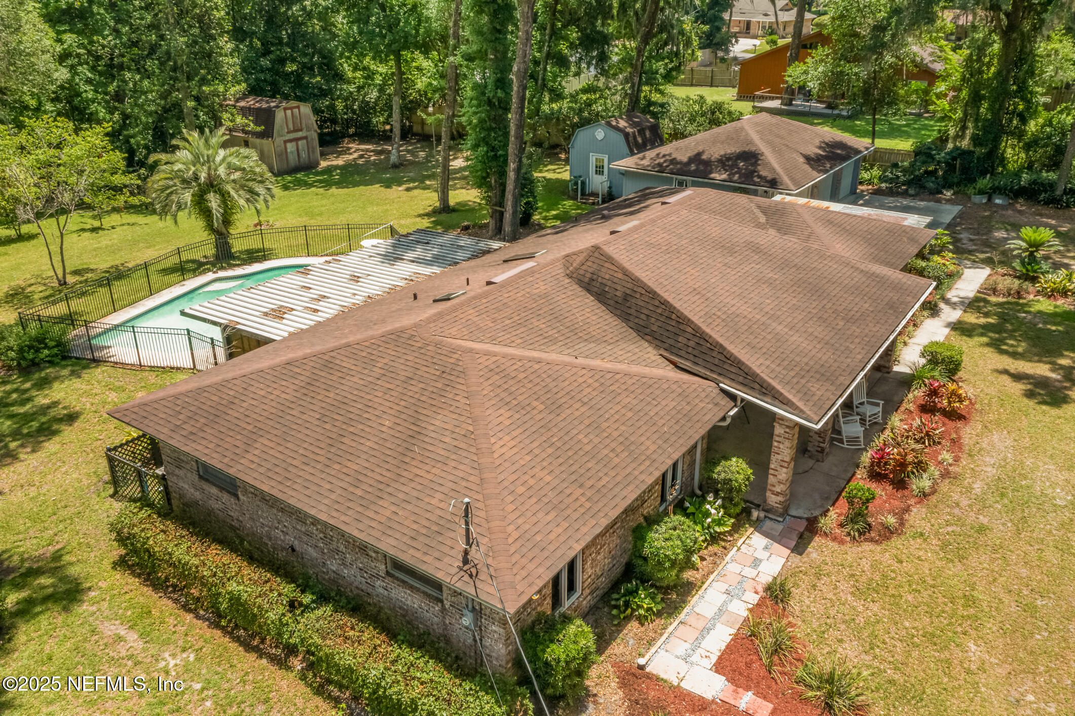 12657 Aladdin Road Jacksonville, FL 32223 - Photo 36 of 47 an aerial view of a house with swimming pool and large trees