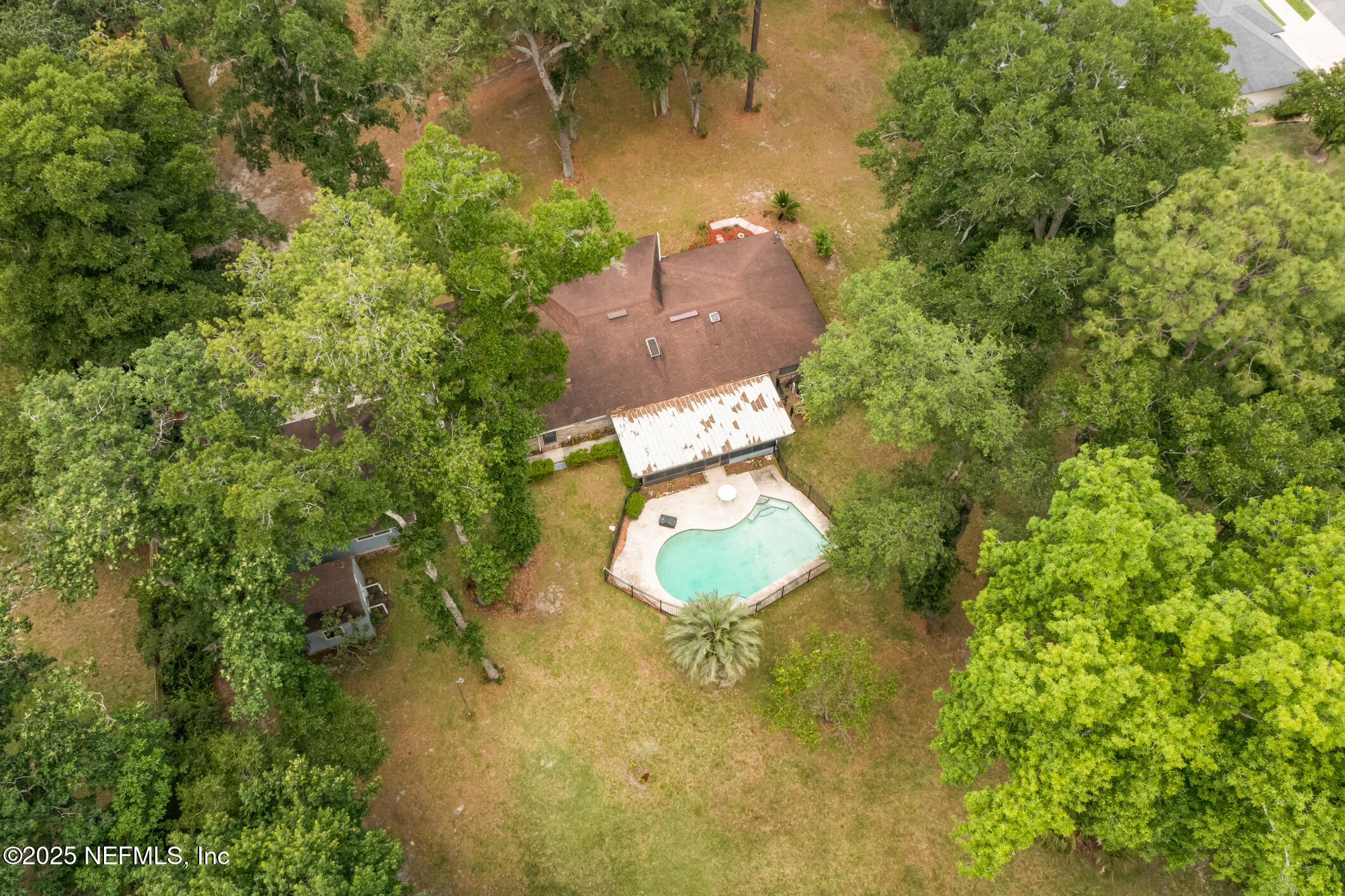 12657 Aladdin Road Jacksonville, FL 32223 - Photo 41 of 47 an aerial view of a house with a yard and trees all around