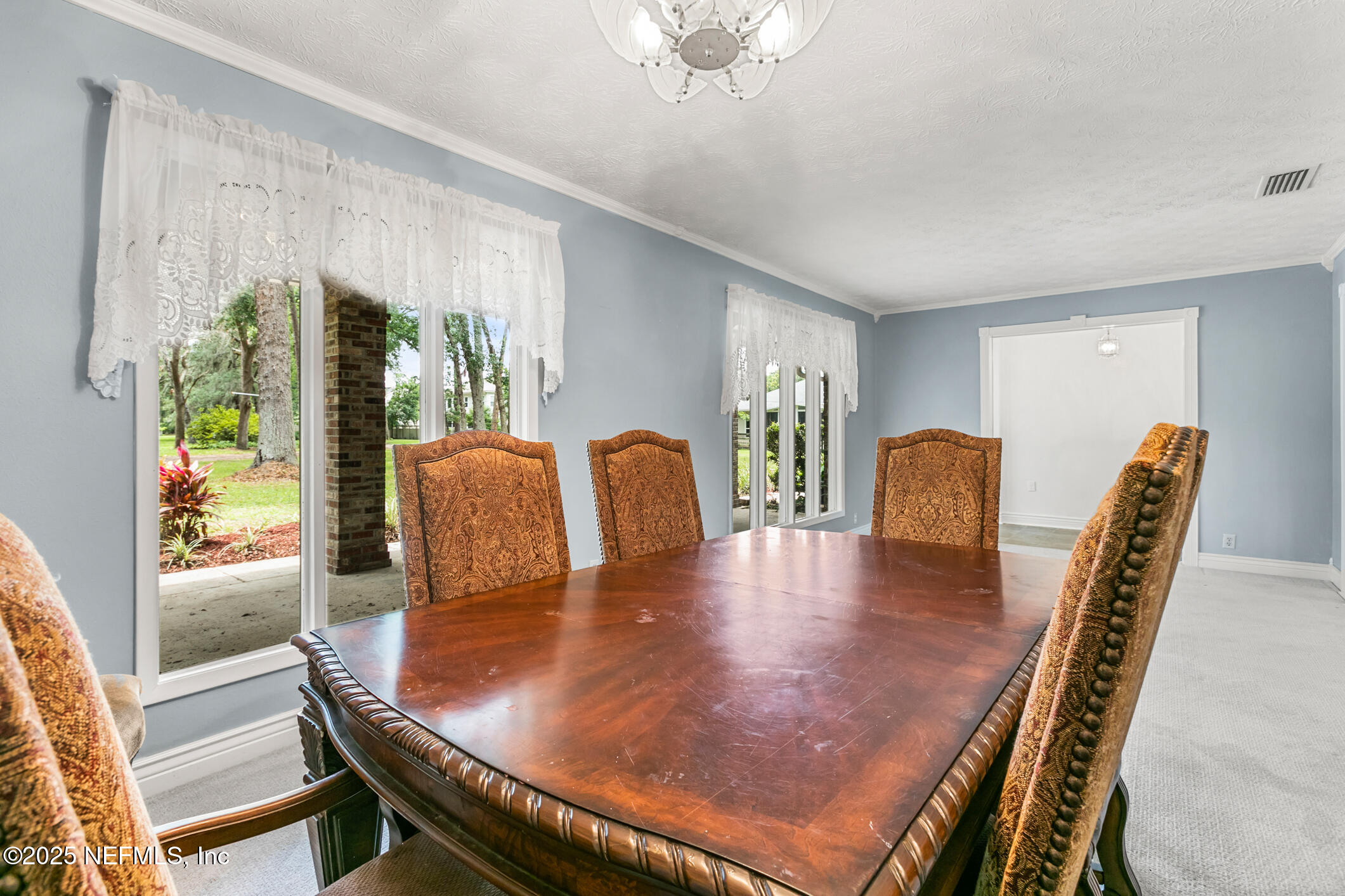 12657 Aladdin Road Jacksonville, FL 32223 - Photo 5 of 47 a dining room with furniture and window