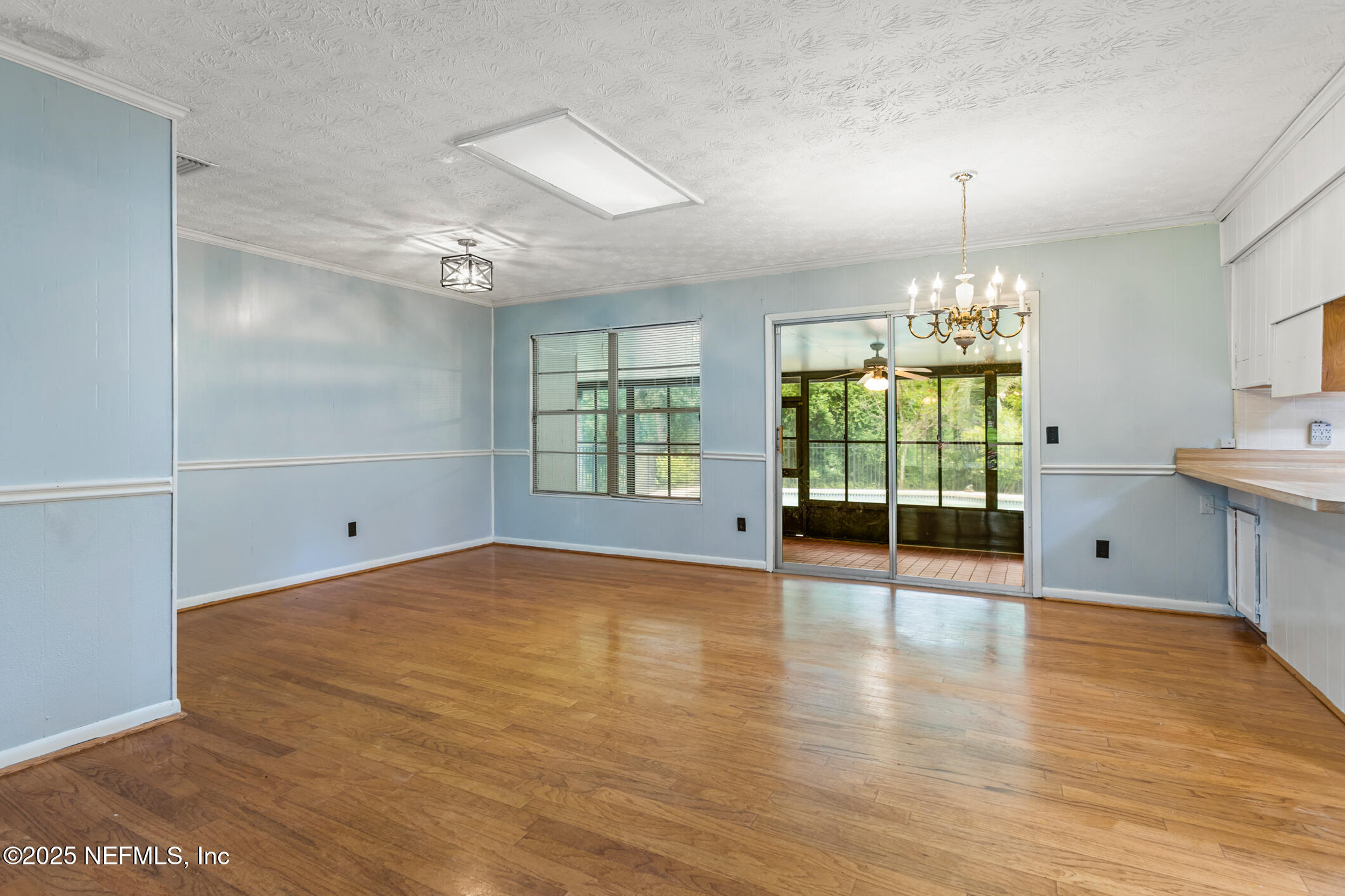 12657 Aladdin Road Jacksonville, FL 32223 - Photo 6 of 47 wooden floor in an empty room with a window