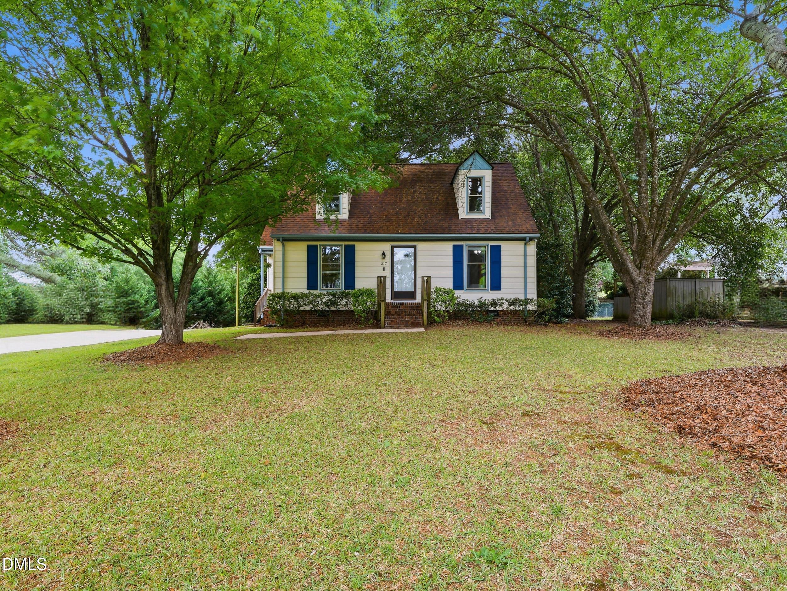 517 Lake Glad Road Wendell, NC 27591 - Photo 3 of 36 a front view of a house with a yard
