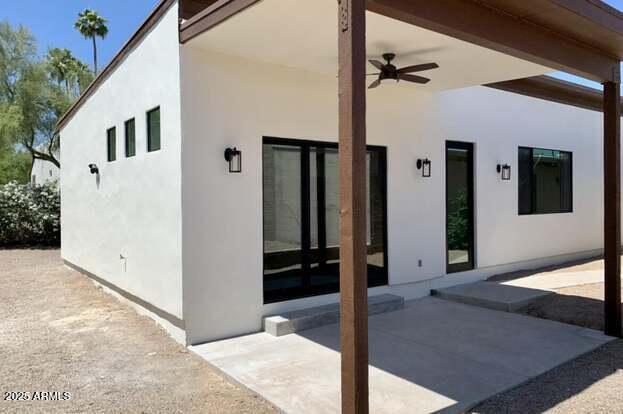 3933 East Rancho Drive Paradise Valley, AZ 85253 - Photo 14 of 27 a view of a hallway with wooden walls and entryway