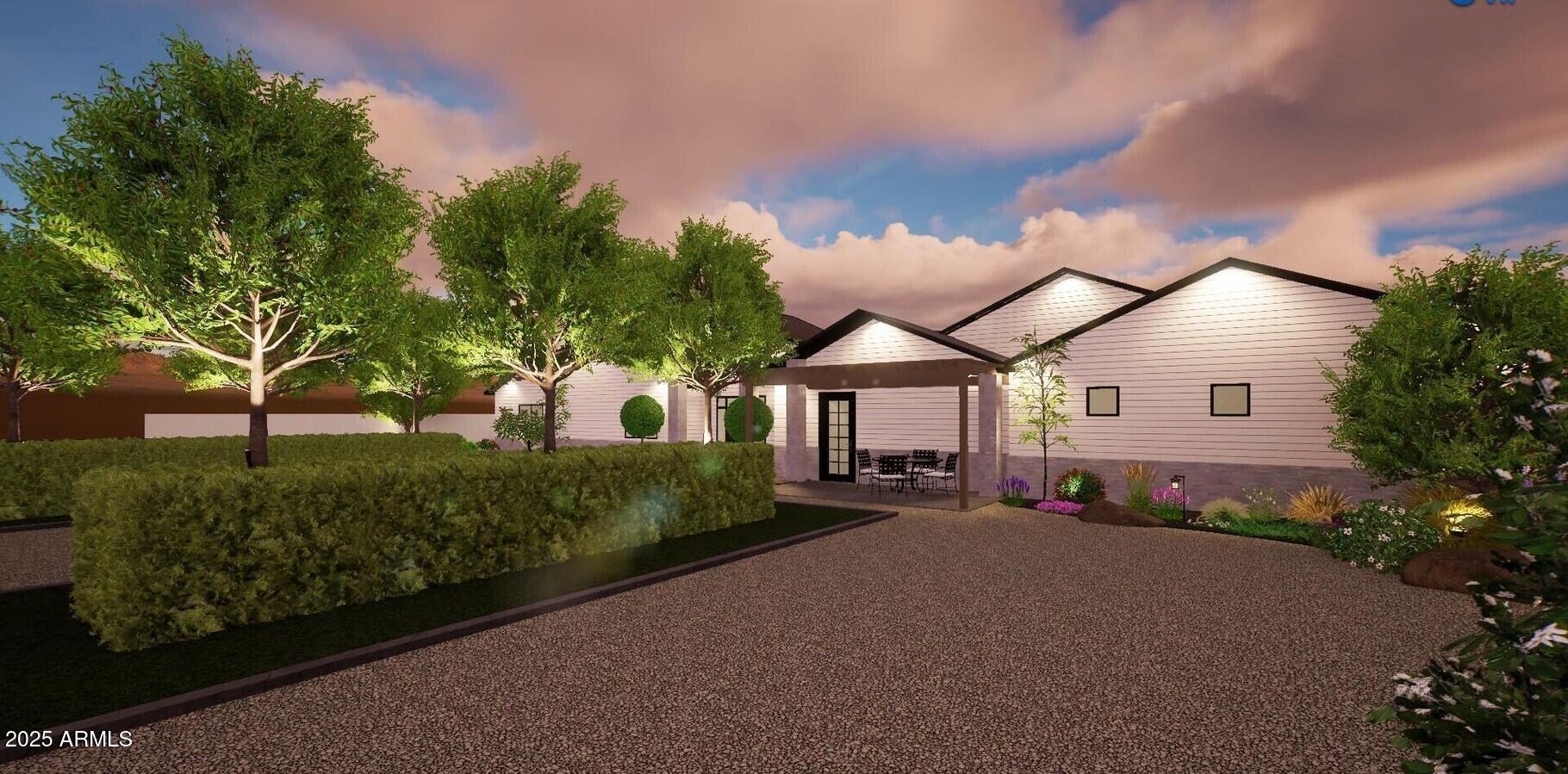 3933 East Rancho Drive Paradise Valley, AZ 85253 - Photo 21 of 27 a front view of a house with a yard and garage