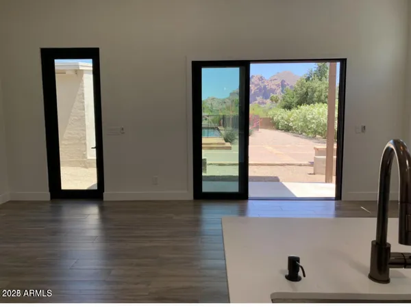 a view of backyard with patio