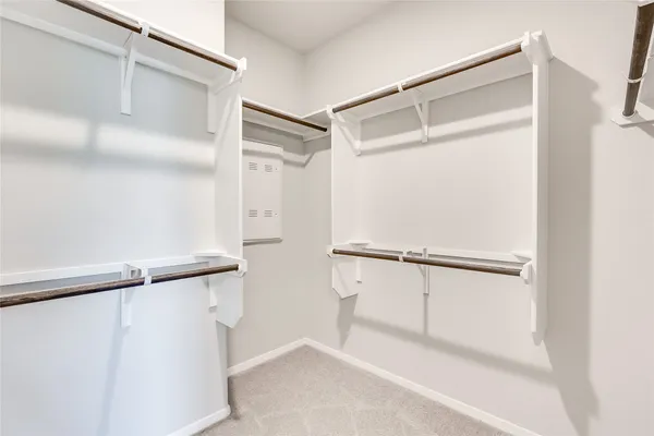 a view of an empty walk in closet