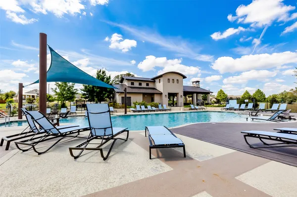 a view of a patio with swimming pool table and chairs