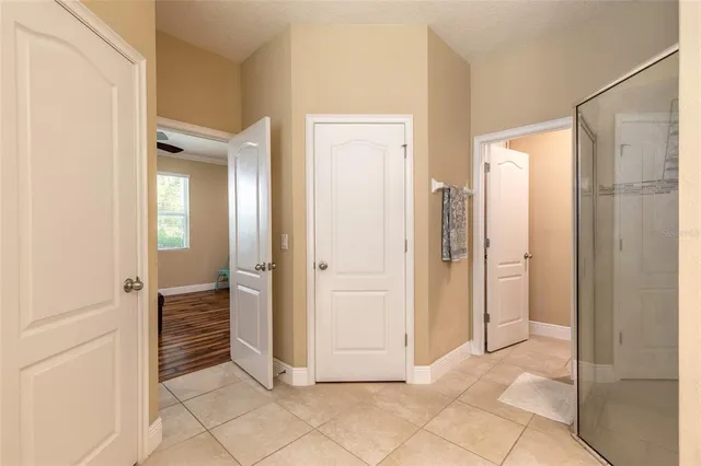 a view of a bathroom with a shower and a sink