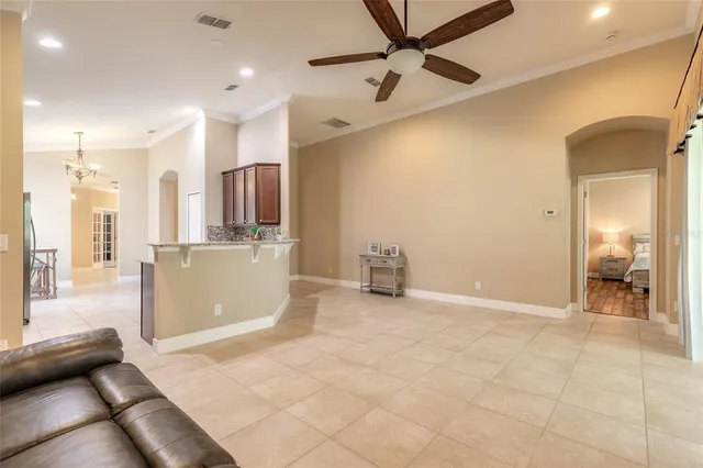 a view of a livingroom with a furniture and kitchen view