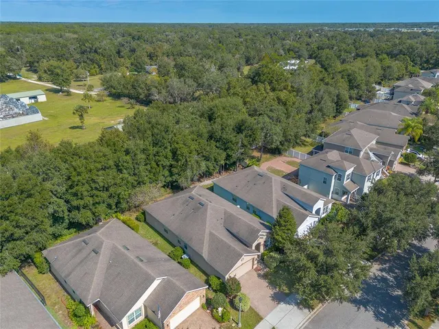an aerial view of a house with a garden