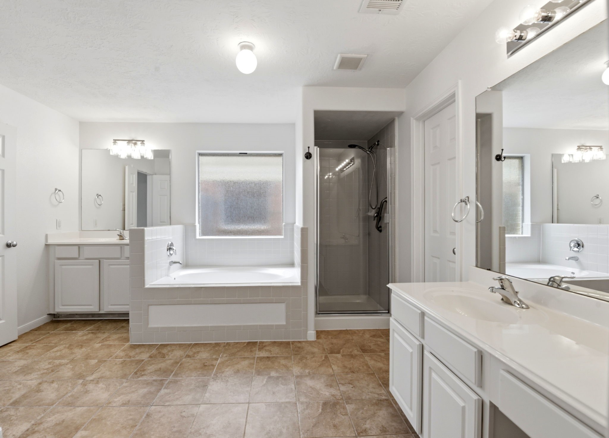 22102 Bridgestone Crossing Drive Spring, TX 77388 - Photo 18 of 38 a bathroom with a sink tub shower and a mirror