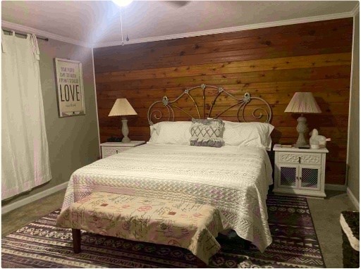 9743 Westbend Road Orange, TX 77632 - Photo 7 of 24 a bedroom with a bed and a window