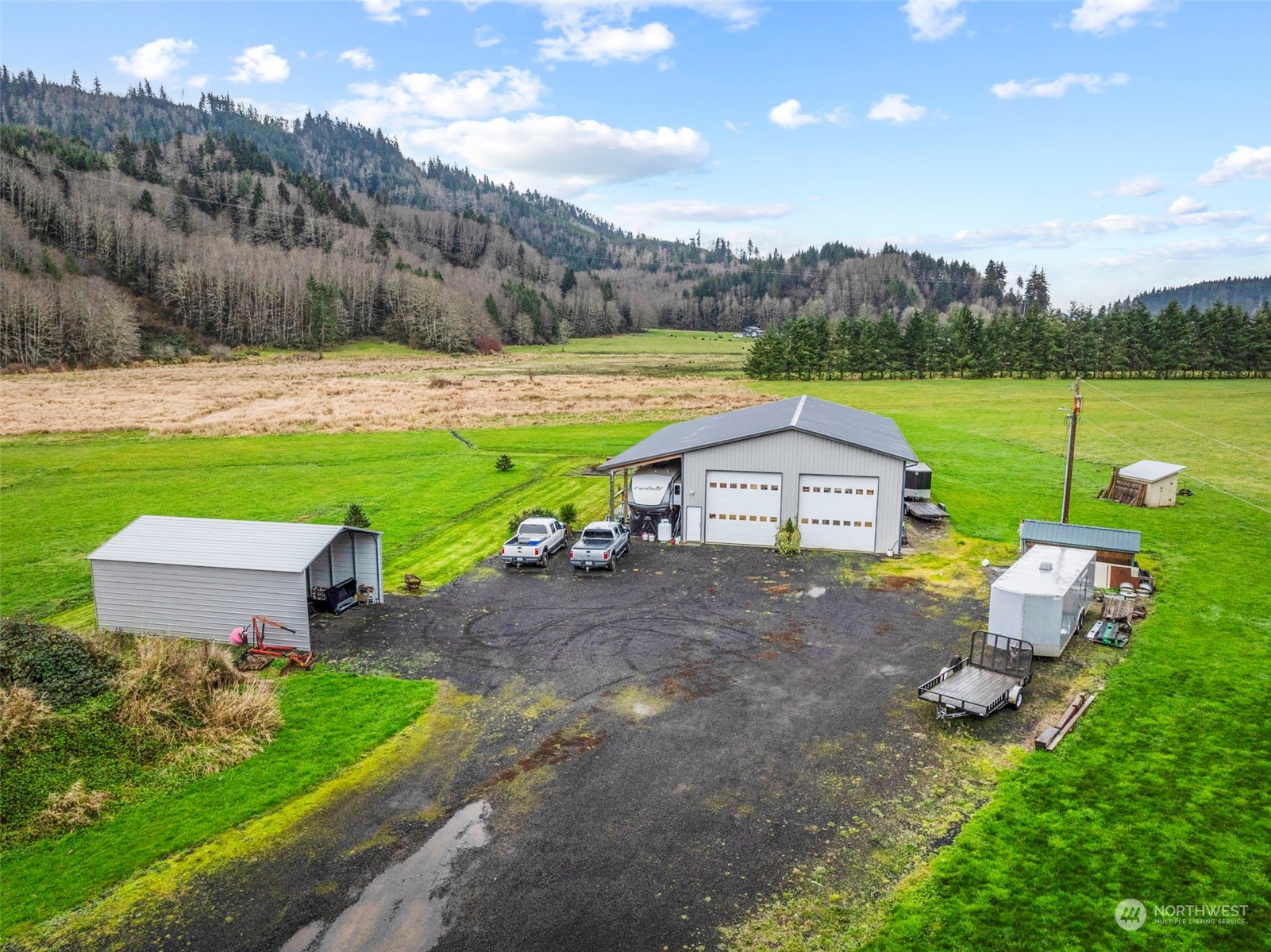 280 East Valley Road Skamokawa, WA 98647 - Photo 1 of 30 a view of a house with a yard and a patio