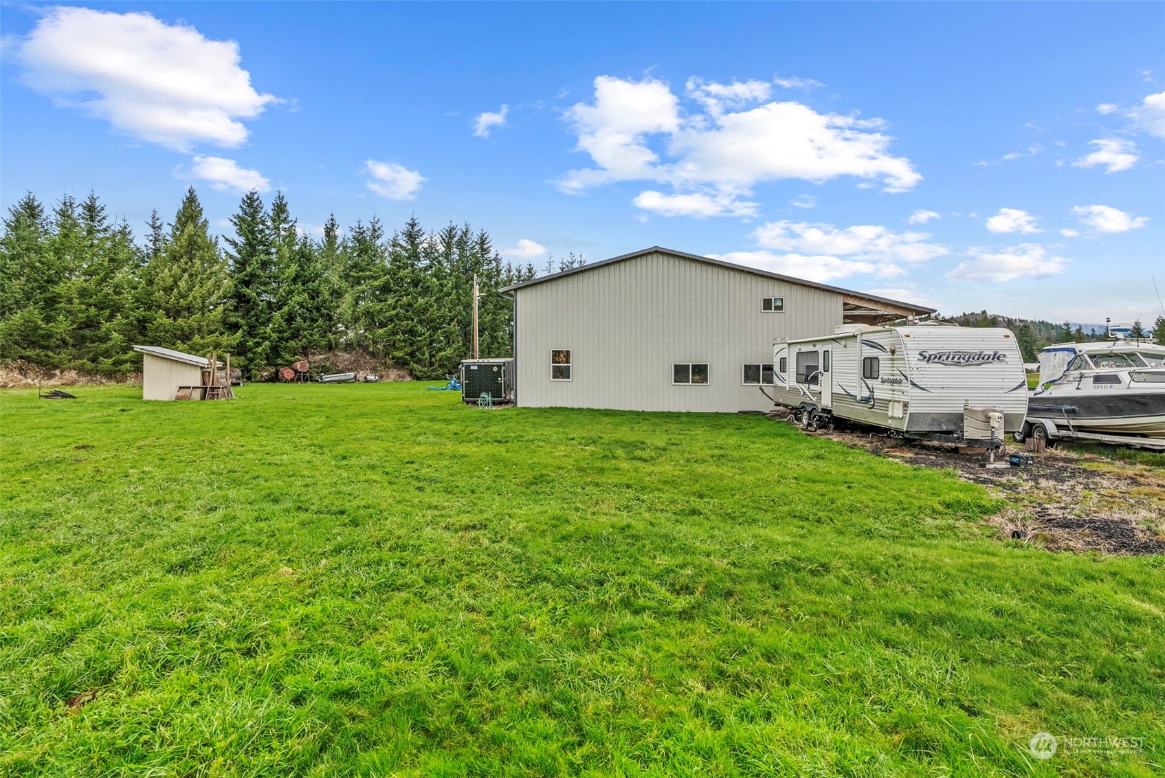 280 East Valley Road Skamokawa, WA 98647 - Photo 11 of 30 a view of a house with backyard and sitting area