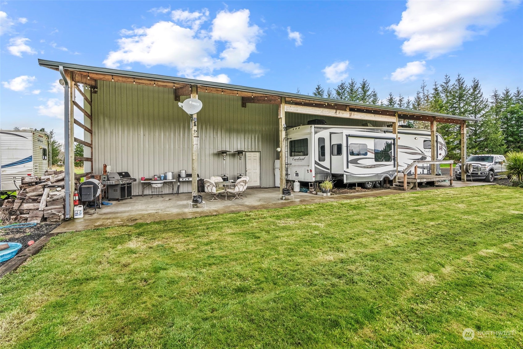 280 East Valley Road Skamokawa, WA 98647 - Photo 14 of 30 a view of a house with a big yard and sitting area