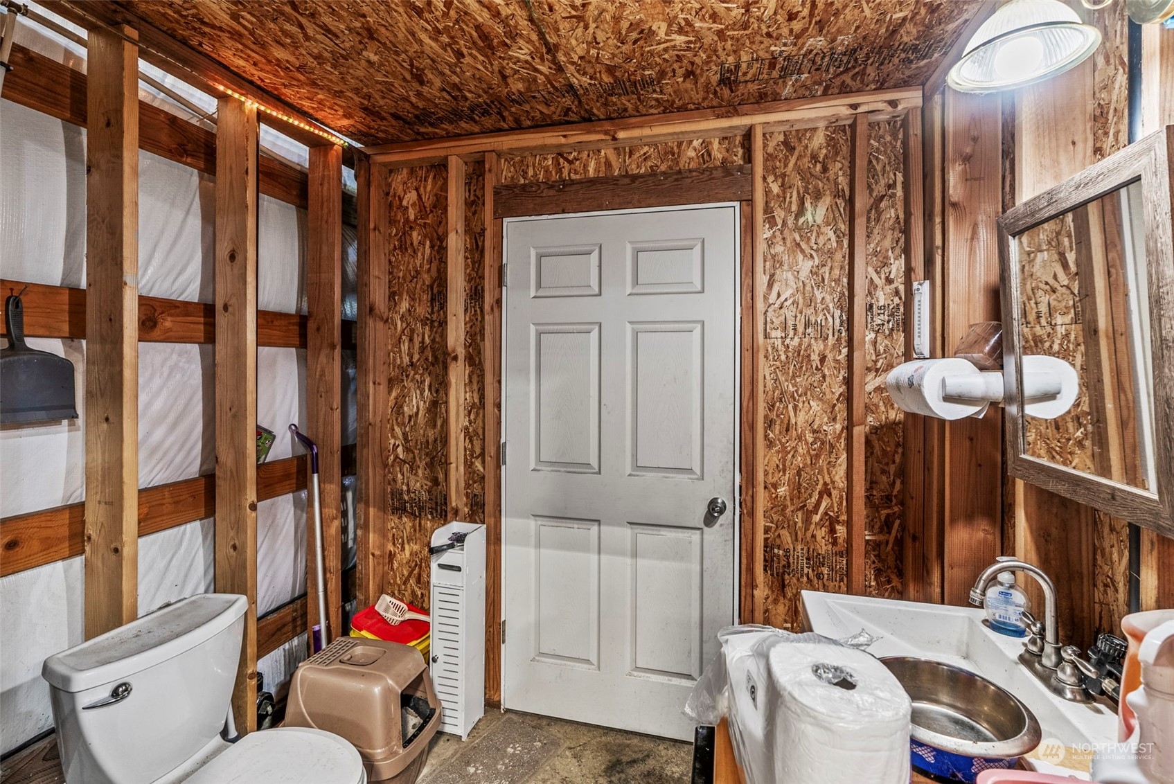 280 East Valley Road Skamokawa, WA 98647 - Photo 20 of 30 a bathroom with a sink a toilet and shower curtain
