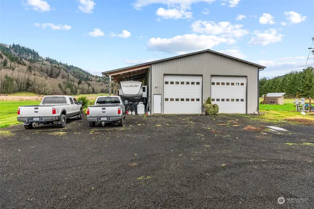 a view of garage with parked cars