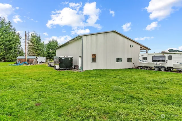 a view of a backyard with sitting area
