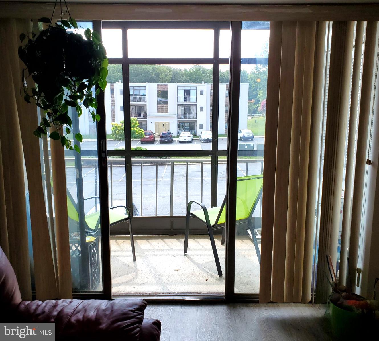 76 Welsh Tract Road, Unit 201 Newark, DE 19713 - Photo 19 of 26 Living Room to Glass enclosed Porch