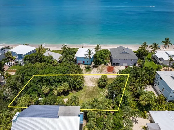 an aerial view of a residential houses with outdoor space