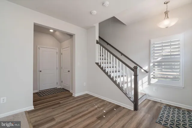 a view of entryway with wooden floor