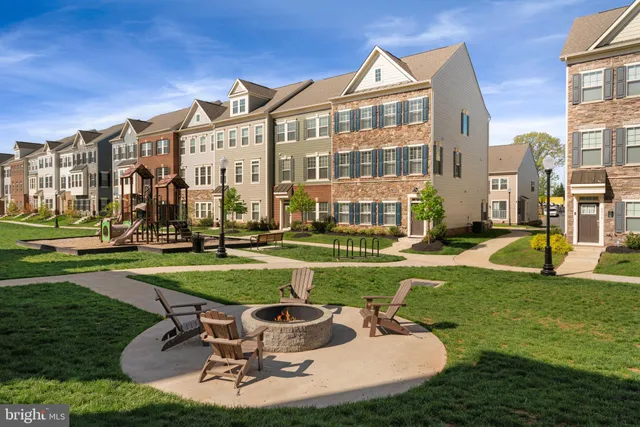 a view of a house with a swimming pool and a yard