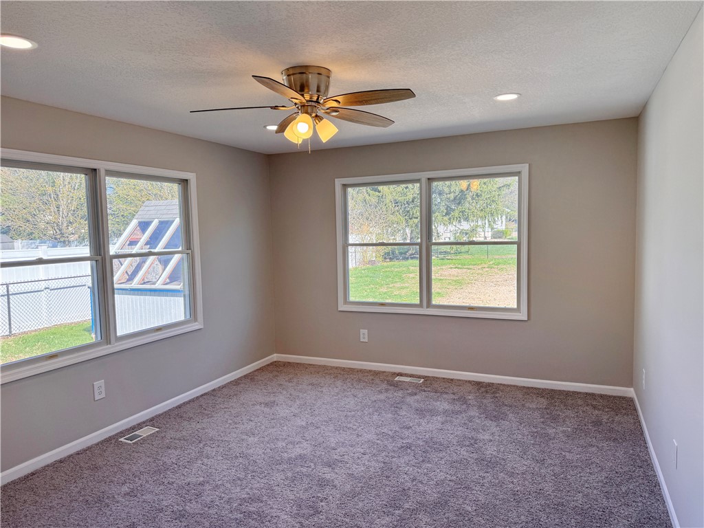 1118 Wedgewood Court Decatur, IL 62526 - Photo 11 of 22 an empty room with windows and fan