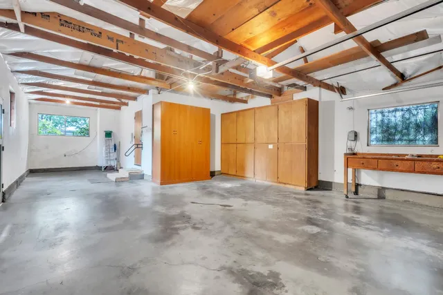an aerial view of a house with a garden and plants