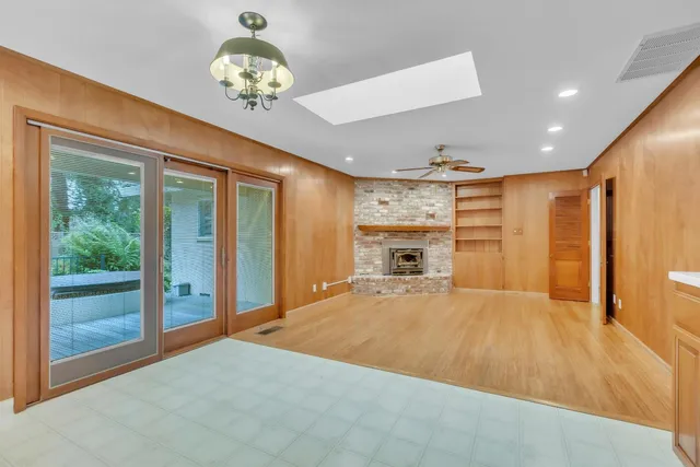 an aerial view of a house with a yard and potted plants