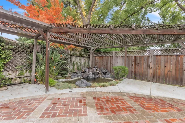 a bathroom with a sink a mirror and a shower