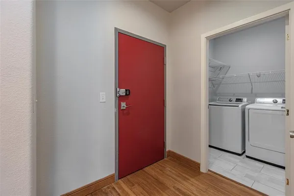 a view of a kitchen with wooden floor