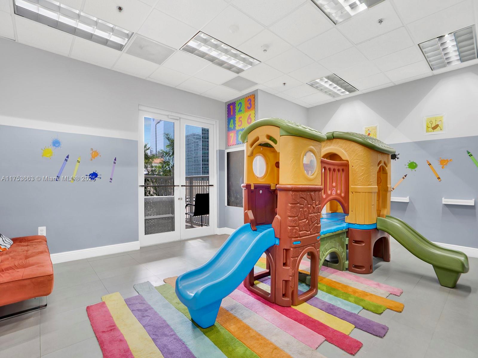 1200 Brickell Bay Drive, Unit 4019 Miami, FL 33131 - Photo 25 of 32 a bedroom with furniture and a wooden floor